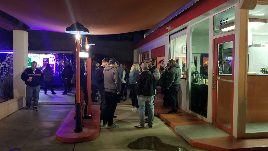 (Celia Shortt Goodyear/Boulder City Review) Guests enjoy their drinks and the warmer temperatures at 2Wheels Garage Grill during the third annual Xi Zeta Rosie Roll pub crawl on Friday, Feb. 22.
