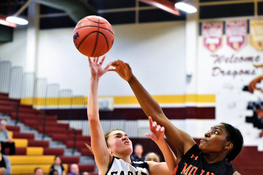 (Robert Vendettoli/Boulder City Review) Junior guard Keely Alexander slashes her way to the basketball for a layup against Mojave in the 3A Southern Region semifinals on Feb. 23. Boulder City lost ...