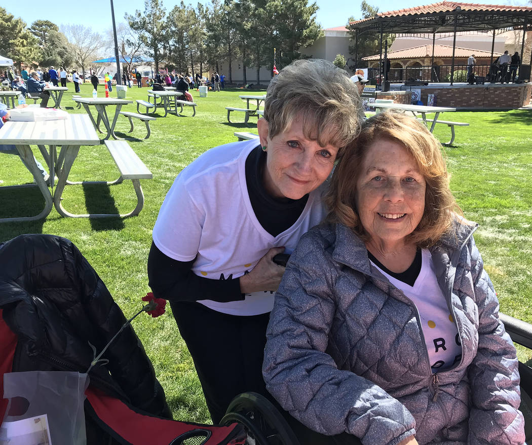 (Hali Bernstein Saylor/Boulder City Review) Kathy Emling, left, president of the Senior Center of Boulder City's board of directors, and Sharon Imlay manned a table filled with baked goods in Bice ...