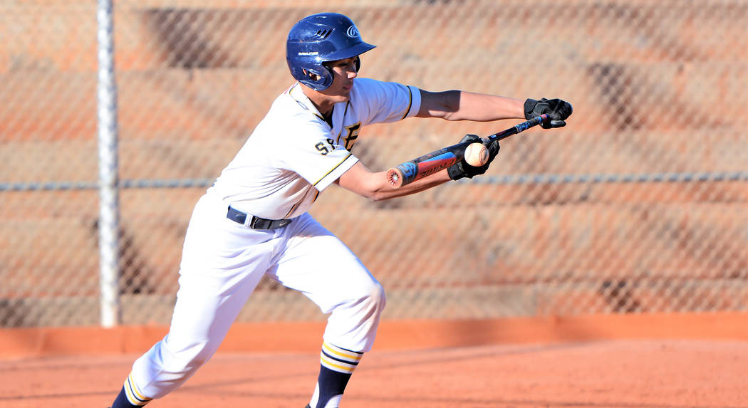 (Robert Vendettoli/Boulder City Review) Laying down a successful bunt, Boulder City High School sophomore Deavin Lopez reached first base safely in the Eagles' 10-0 victory over Western on March 1 ...