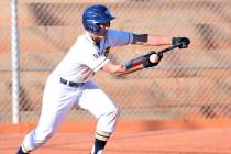 (Robert Vendettoli/Boulder City Review) Laying down a successful bunt, Boulder City High School sophomore Deavin Lopez reached first base safely in the Eagles' 10-0 victory over Western on March 1 ...