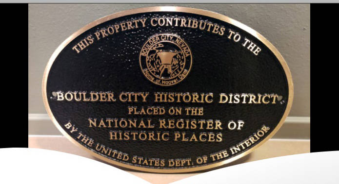 Plaques recognizing a property's contribution to the Boulder City Historic District are availab ...