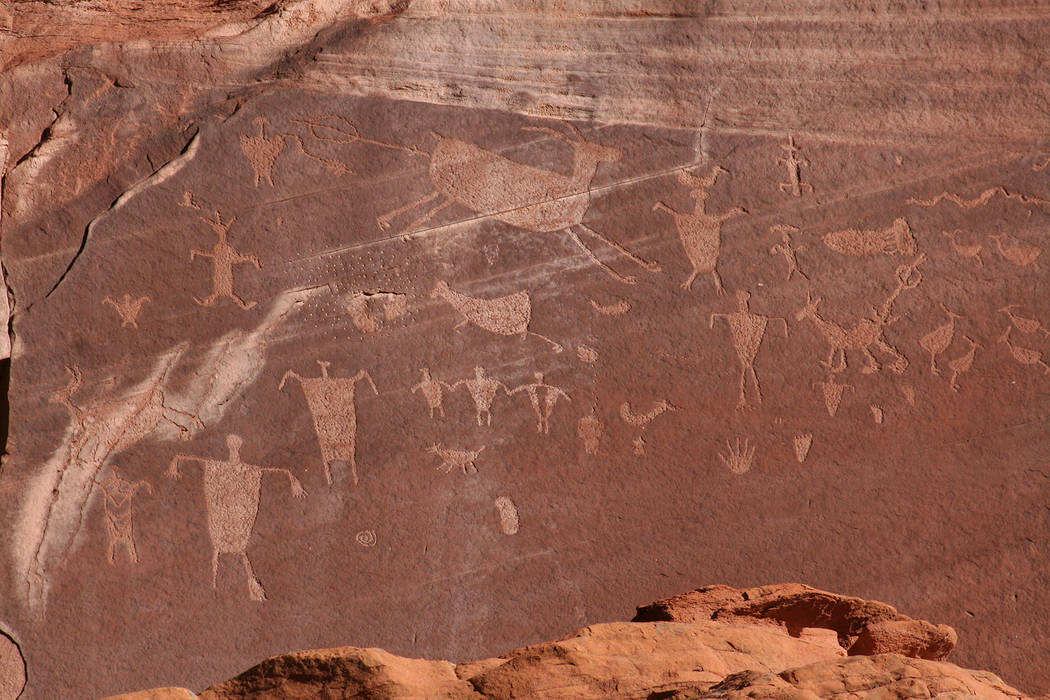 (Deborah Wall) Rock art such as pictographs and petroglyphs, the latter seen here, can be found ...