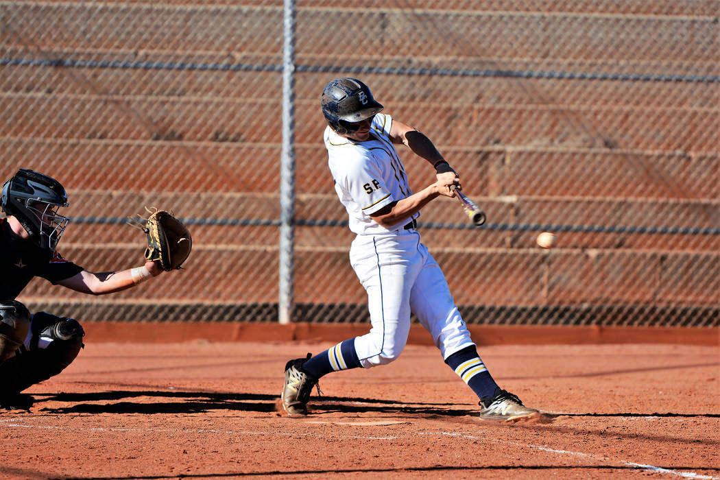 (Robert Vendettoli/Boulder City Review) Senior Jimmy Dunagan hits a line drive up the middle ag ...