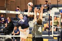 (Robert Vendettoli/Boulder City Review) Rising above the net, junior Dylan Leasure spikes the b ...