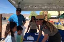 (Hali Bernstein Saylor/Boulder City Review) Ranger Sylvia McMartin, right, welcomes Landry Chan ...