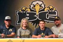 (Andrea Moore) Hunter Moore, second from right, signs his letter of intent to join Boulder City ...