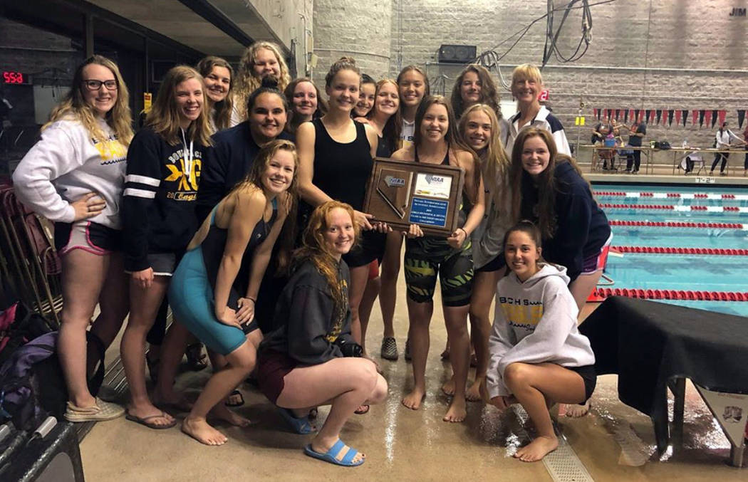 (Amy Wagner) Members of Boulder City High School's girls swim team celebrate winning the region ...