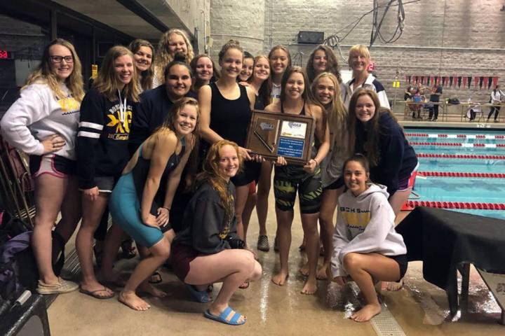 (Amy Wagner) Members of Boulder City High School's girls swim team celebrate winning the region ...