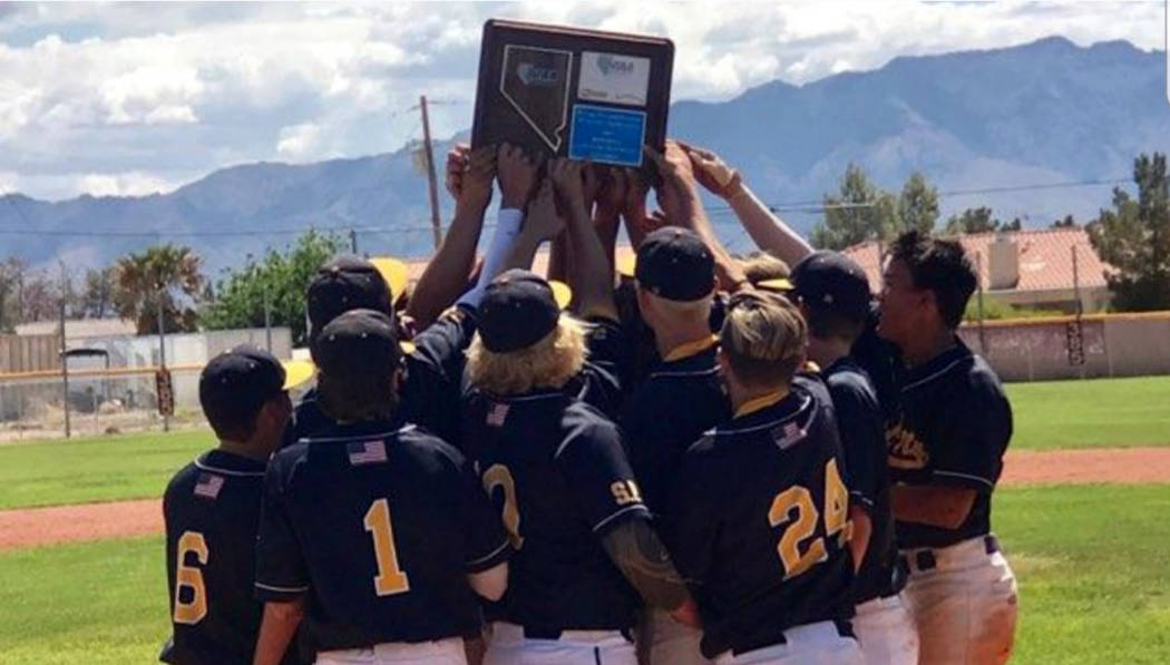 (Daphne Brownson) Members of Boulder City High School's baseball team celebrate winning the reg ...