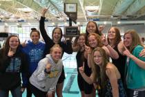 (Daphne Brownson) Members of Boulder City High School's girls swim team celebrae after winning ...
