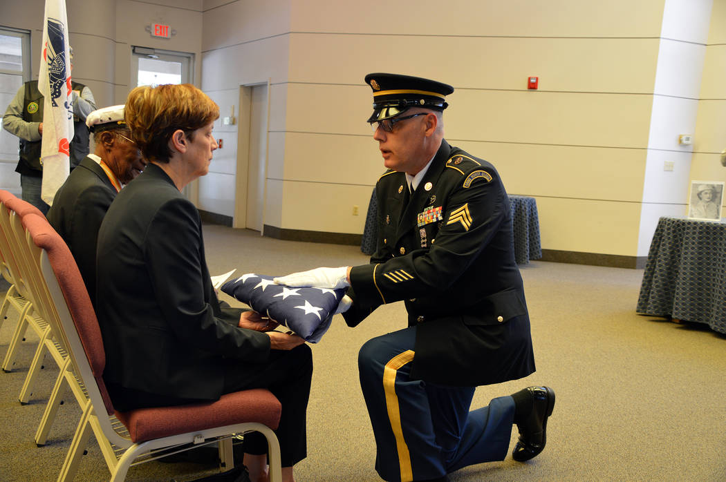 (Celia Shortt Goodyear/Boulder City Review) A U.S. Army sergeant presents an American flag to N ...