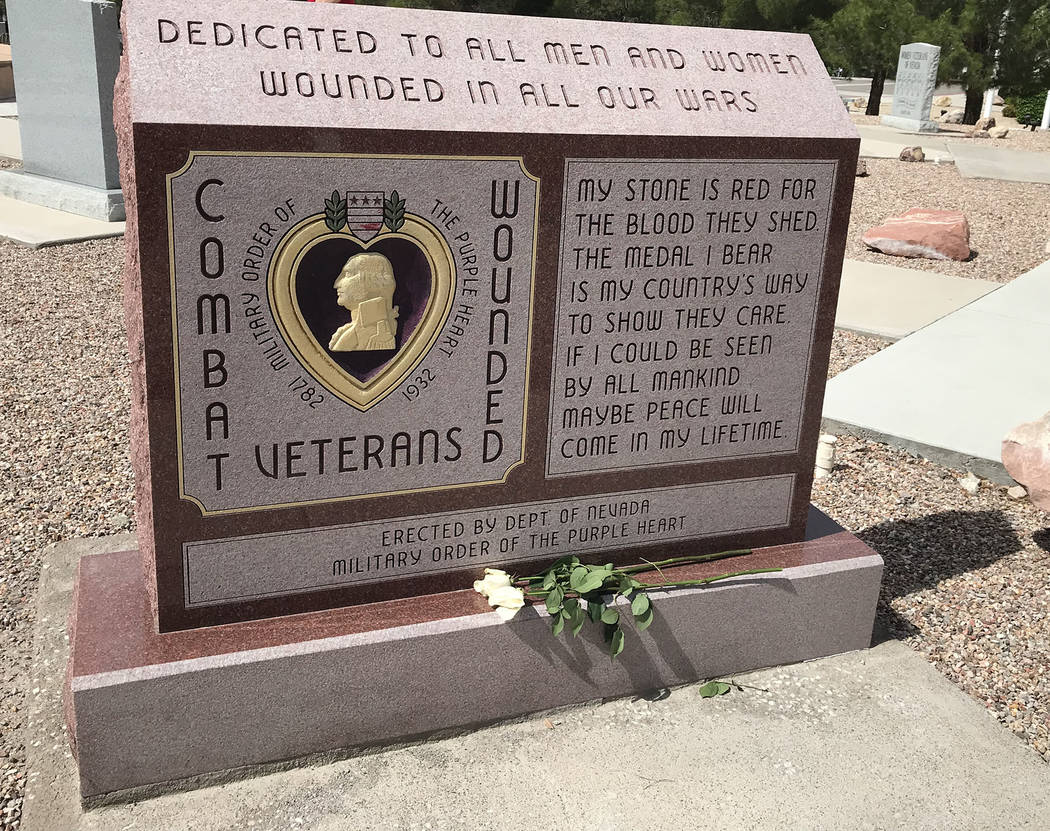 (Hali Bernstein Saylor/Boulder City Review) White roses were placed at a memorial to honor Purp ...