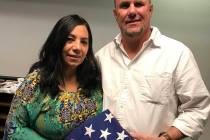(Hali Bernstein Saylor/Boulder City Review) Mari and Joe Fex of Boulder City found a flag on th ...