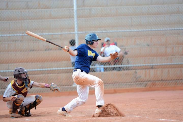 (Robert Vendettoli/Boulder City Review) Hitting a line drive to center field, Clark Newby drive ...