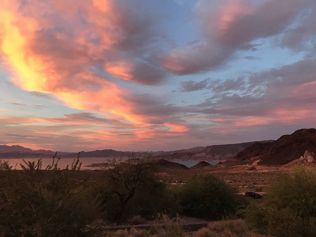 (Hali Bernstein Saylor/Boulder City Review) The sky above Lake Mead became a colorful palette S ...