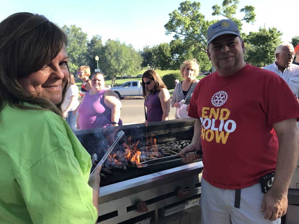 (Hali Bernstein Saylor/Boulder City Review) Rotarians Chris Romero, left, and John Chase cooked ...