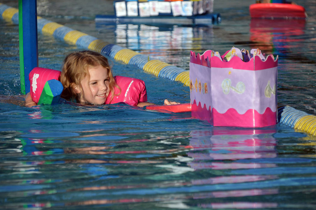 Celia Shortt Goodyear/Boulder City Review Four-year-old Kinsley Irwin races her boat, U.S.S. Ra ...