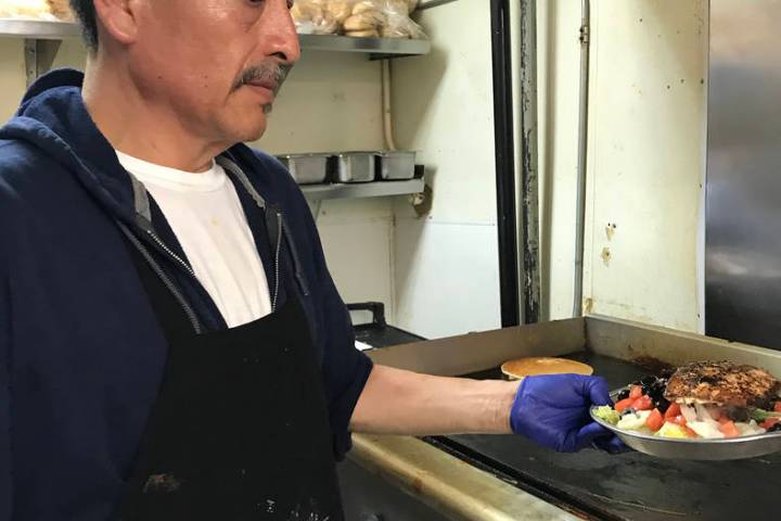 (Hali Bernstein Saylor/Boulder City Review) Jose Bejar, a cook at Southwest Diner, prepares a g ...