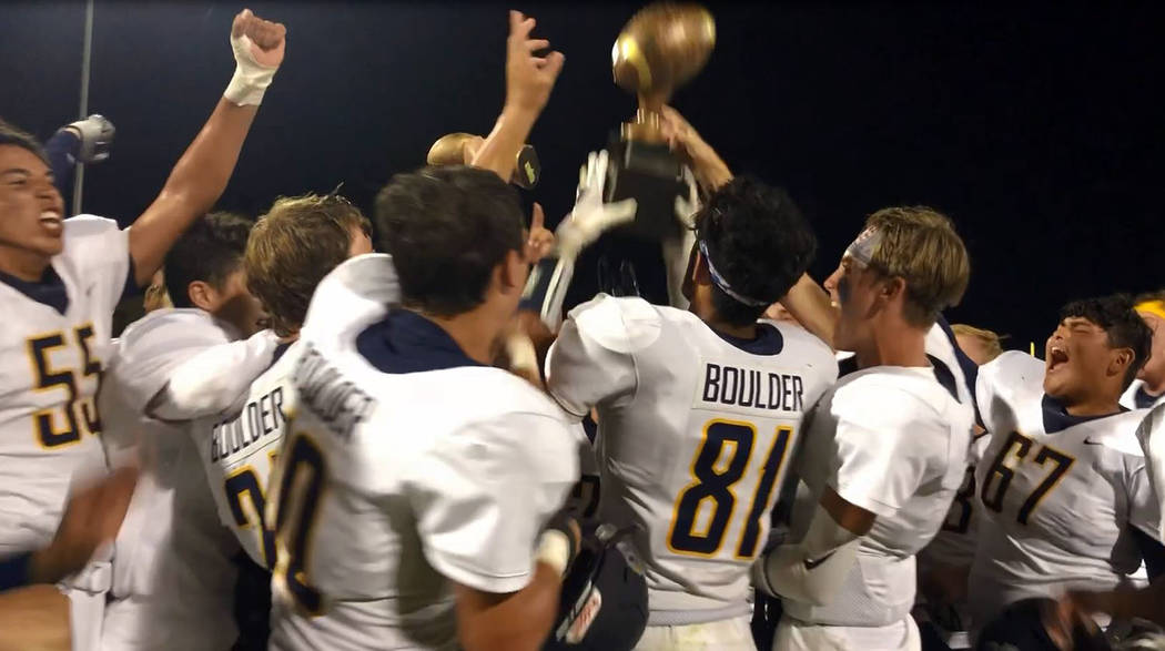 (Amy Wagner) The Boulder City High School varsity football team celebrates its 12-7 road victor ...