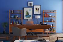 (Norma Vally) A blue accent wall brings color and calm to an office.