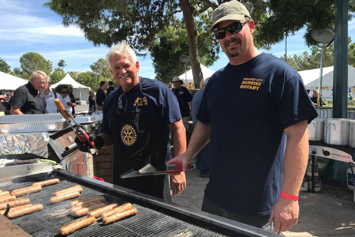 Dale Ryan, left, and Jim Parsons man the grill at the 2018 Wurst Festival presented by the Boul ...