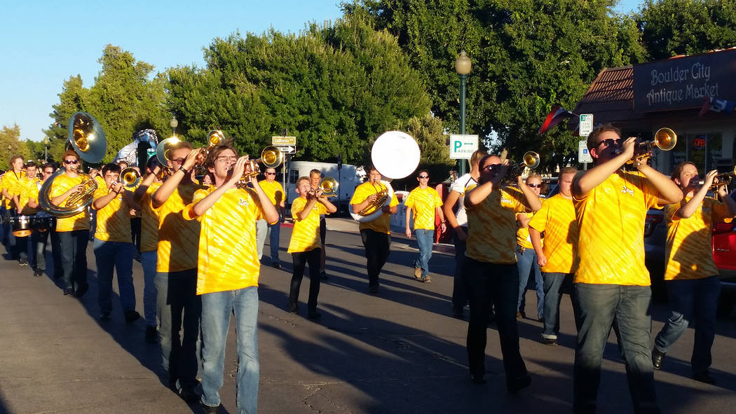 The Boulder City High School marching band starts off the 2018 homecoming parade in downtown Bo ...