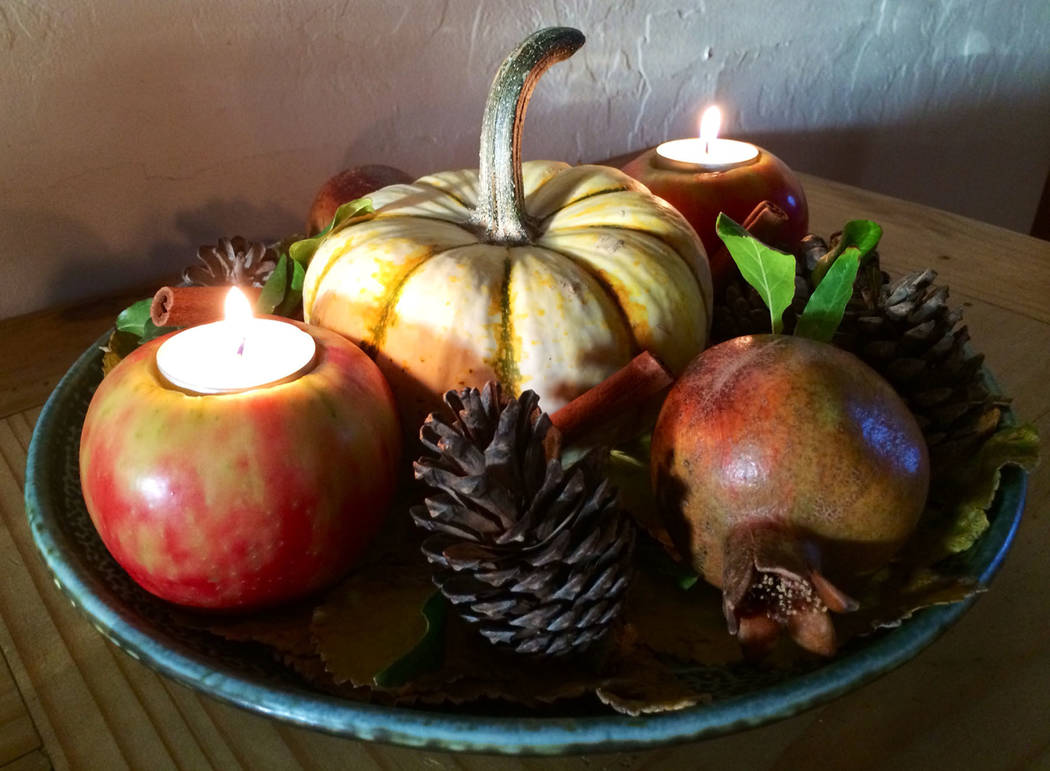 (Norma Vally) Create your own fall-scented candle by carving out space for a tealight in an app ...