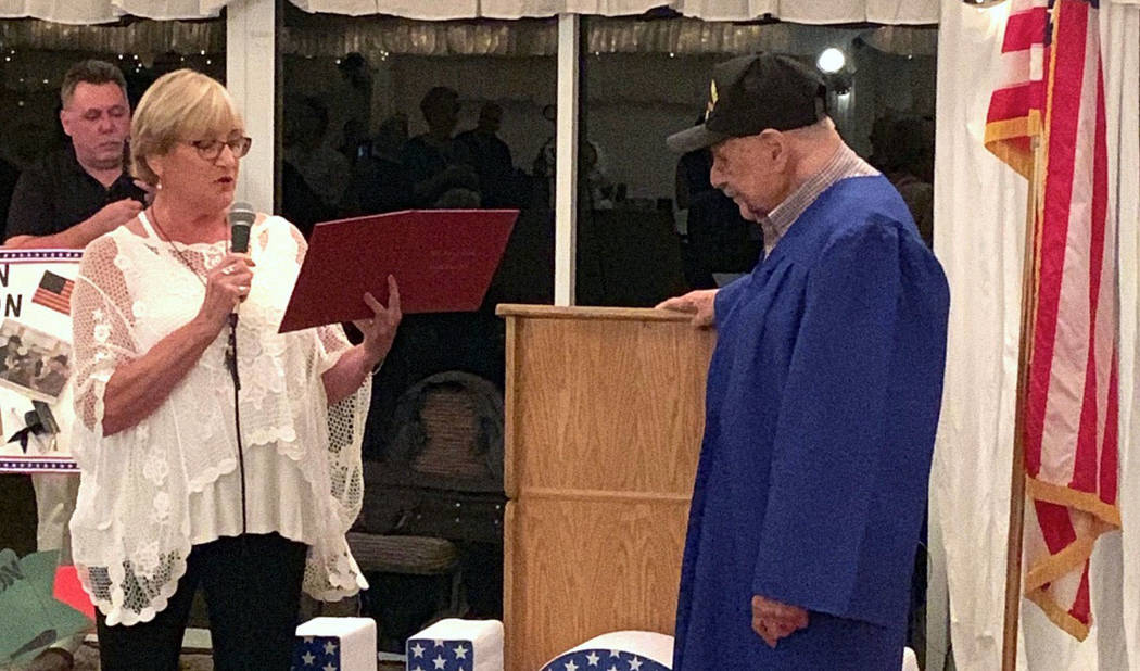 (Charm McElree) Boulder City resident Charm McElree presents a high school diploma to 96-year-o ...
