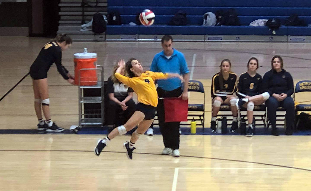 (Boulder City High School) Boulder City High School sophomore Zoey Robinson spikes the ball aga ...