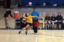 (Boulder City High School) Boulder City High School sophomore Zoey Robinson spikes the ball aga ...