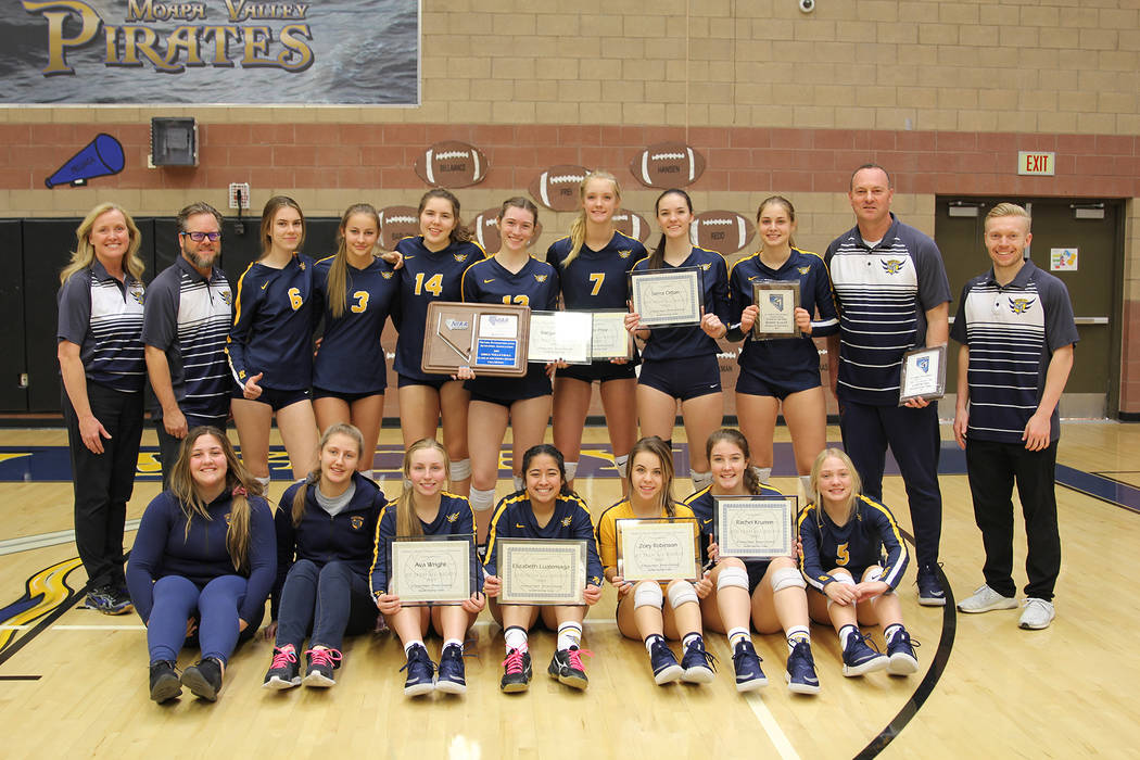 (Cherise Hinman) Members and coaches of Boulder City High School’s girls volleyball team cele ...