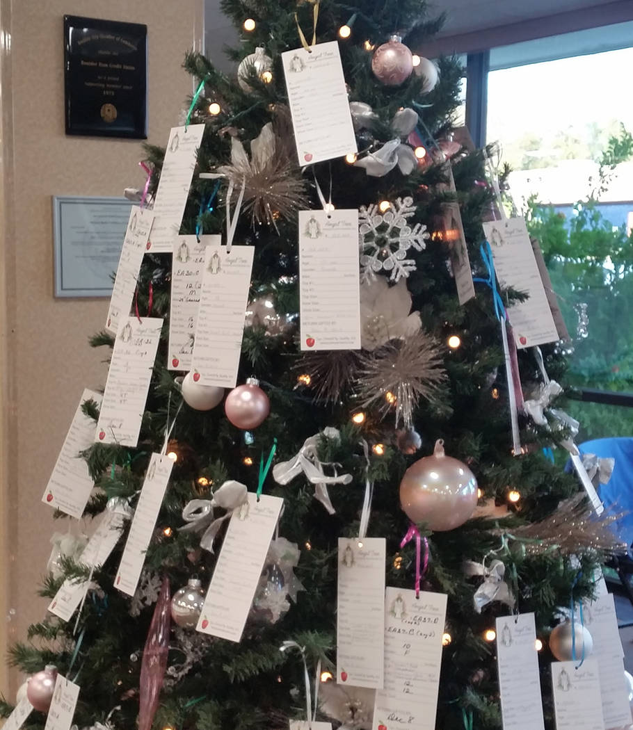 Tags with information about the needs of local children and seniors adorn the Angel Tree set up ...