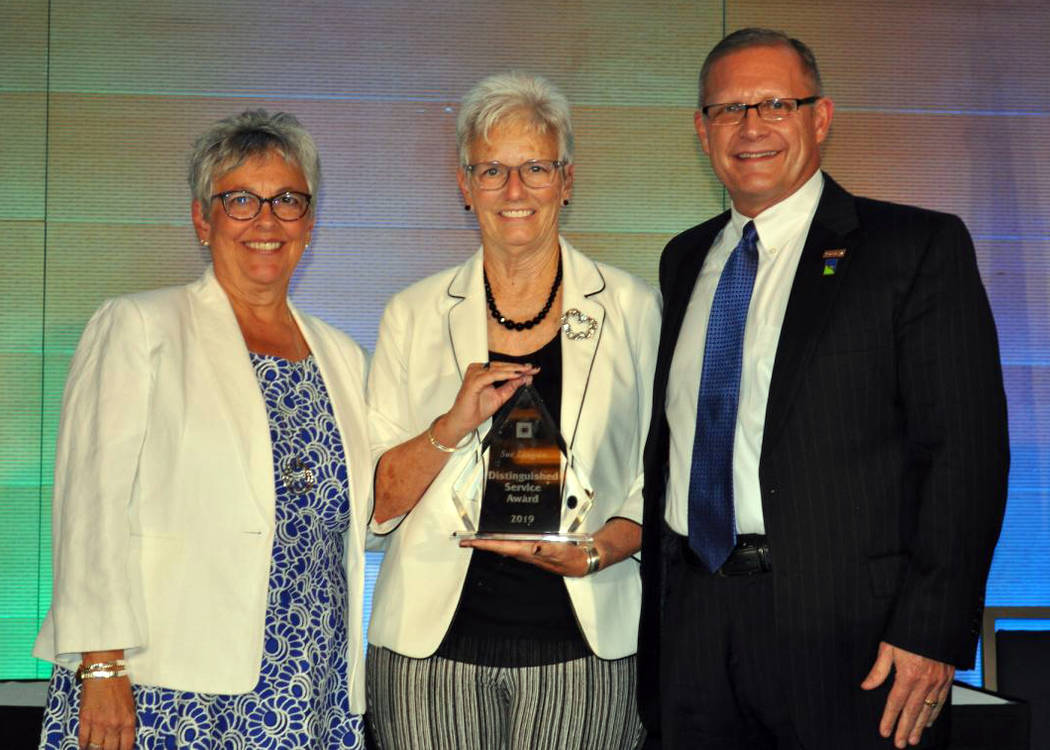 (Nevada Credit Union League) Sue Longson, center, of Boulder Dam Credit Union, received the 201 ...