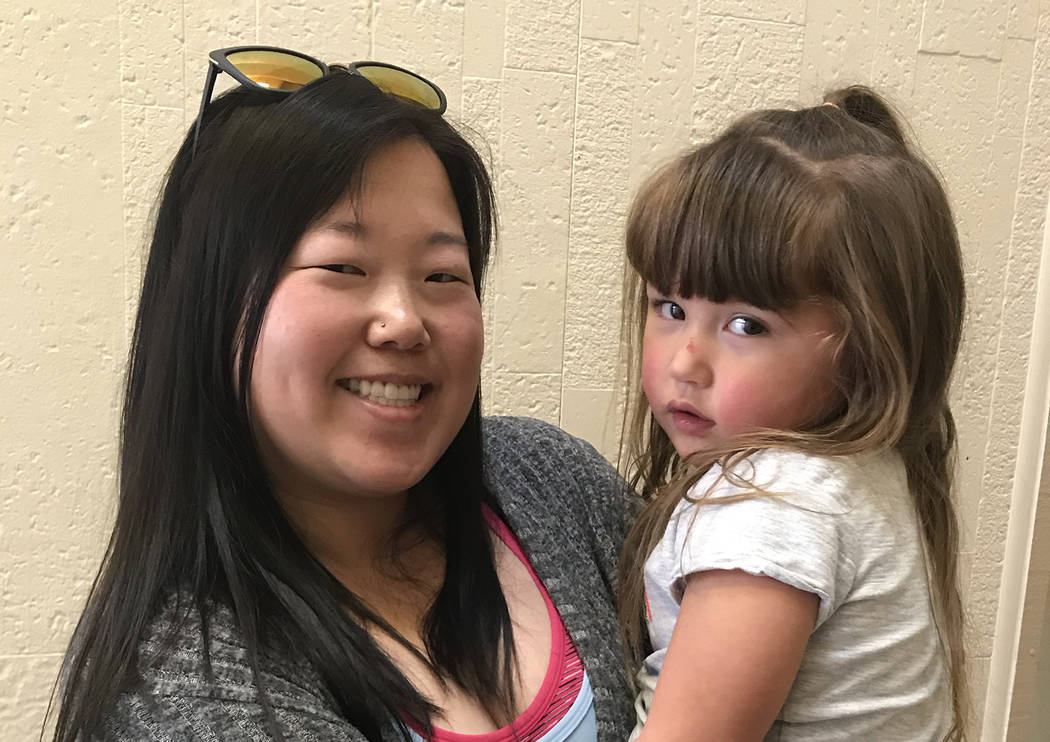 (Hali Bernstein Saylor/Boulder City Review) Kristy Gildner, holding her 3-year-old daughter, Da ...