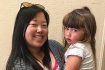 (Hali Bernstein Saylor/Boulder City Review) Kristy Gildner, holding her 3-year-old daughter, Da ...