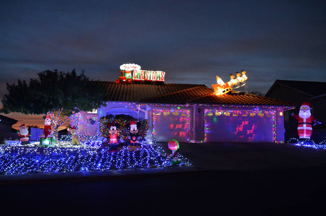 (Celia Shortt Goodyear/Boulder City Review) The home at 796 Los Tavis Way features inflatable d ...