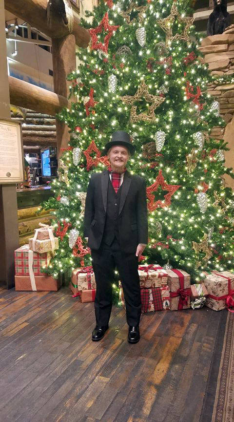 Christy Corthell Nathaniel Corthell takes time for a photo after caroling at Bass Pro Shops in ...