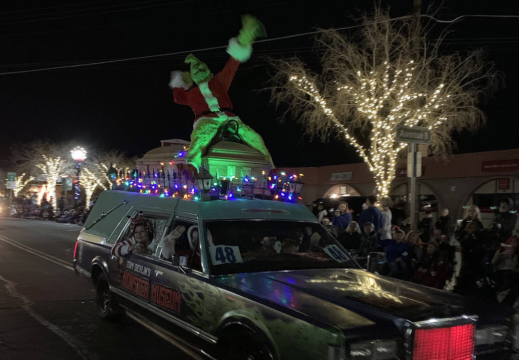(Hali Bernstein Saylor/Boulder City Review) The Grinch rode atop a hearse from Tom Devlin’s M ...