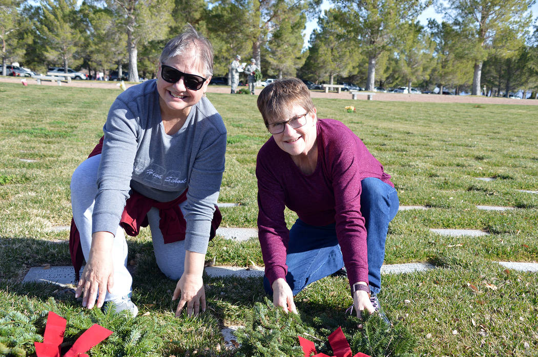 Celia Shortt Goodyear/Boulder City Review Lila Bair, left, and Kolleen Stolte lay wreaths on th ...