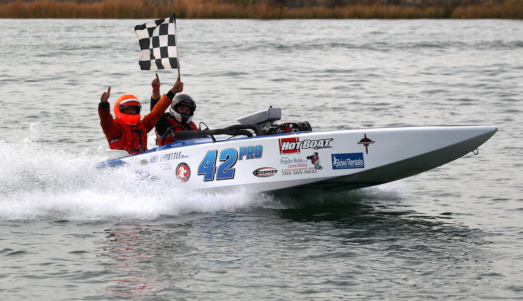 (Mark McLaughlin Photography) Matt Bookey, left, drives P42 Penalty Box, a crackerbox boat owne ...