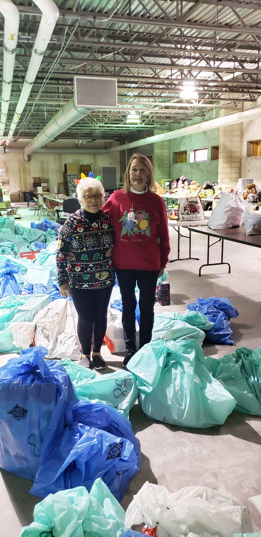 (Emergency Aid of Boulder City) Emergency Aid of Boulder City distributed Christmas gifts from ...