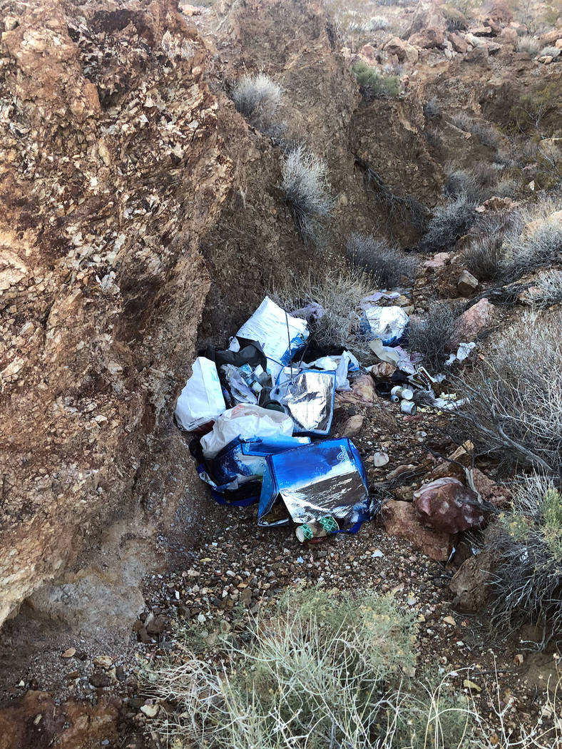 (Ed Knapp) The remains of a homeless camp in Bootleg Canyon features rotting debris and old ins ...
