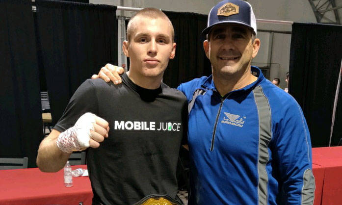 (Kim Cox) Octavian Trumbo, left, who wrestled at Boulder City High School, celebrates his title ...