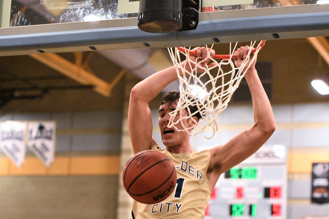 (Robert Vendettoli/Boulder City Review) Junior Ethan Speaker slams home a thunderous dunk again ...