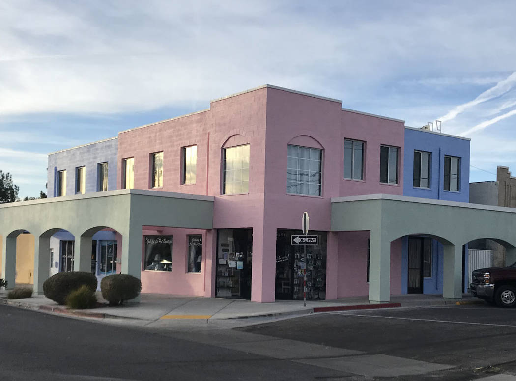 (Paradise Found Plaza) Pink, blue and green sherbet colors now accent the exterior of Paradise ...