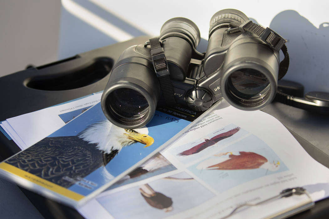 (Ellen Schmidt/Las Vegas Review-Journal) Materials to find and identify eagles sit on the boat ...