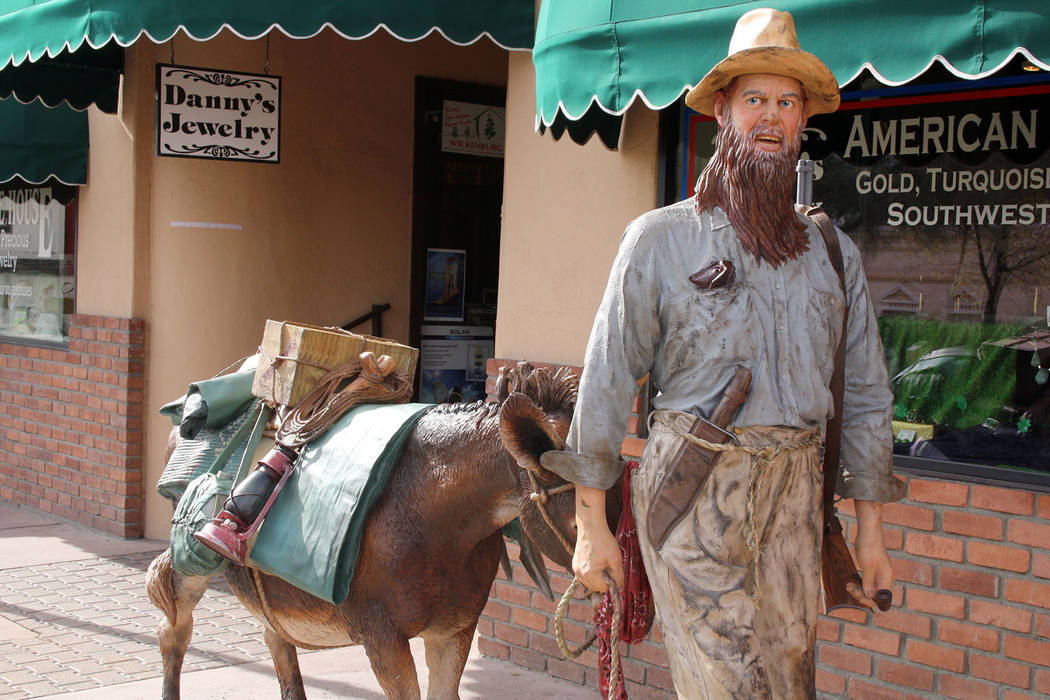 (Deborah Wall) A statue of a miner leading his burro during the mining boom in the 19th century ...