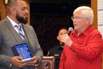(Celia Shortt Goodyear/Boulder City Review) Marcos Caro, left, is given an award at the Jan. 28 ...