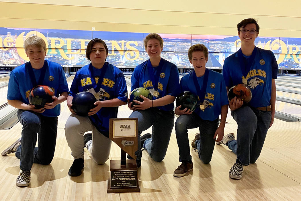 (Amy Wagner) Members of the boys bowling team from Boulder City High School celebrate winning t ...